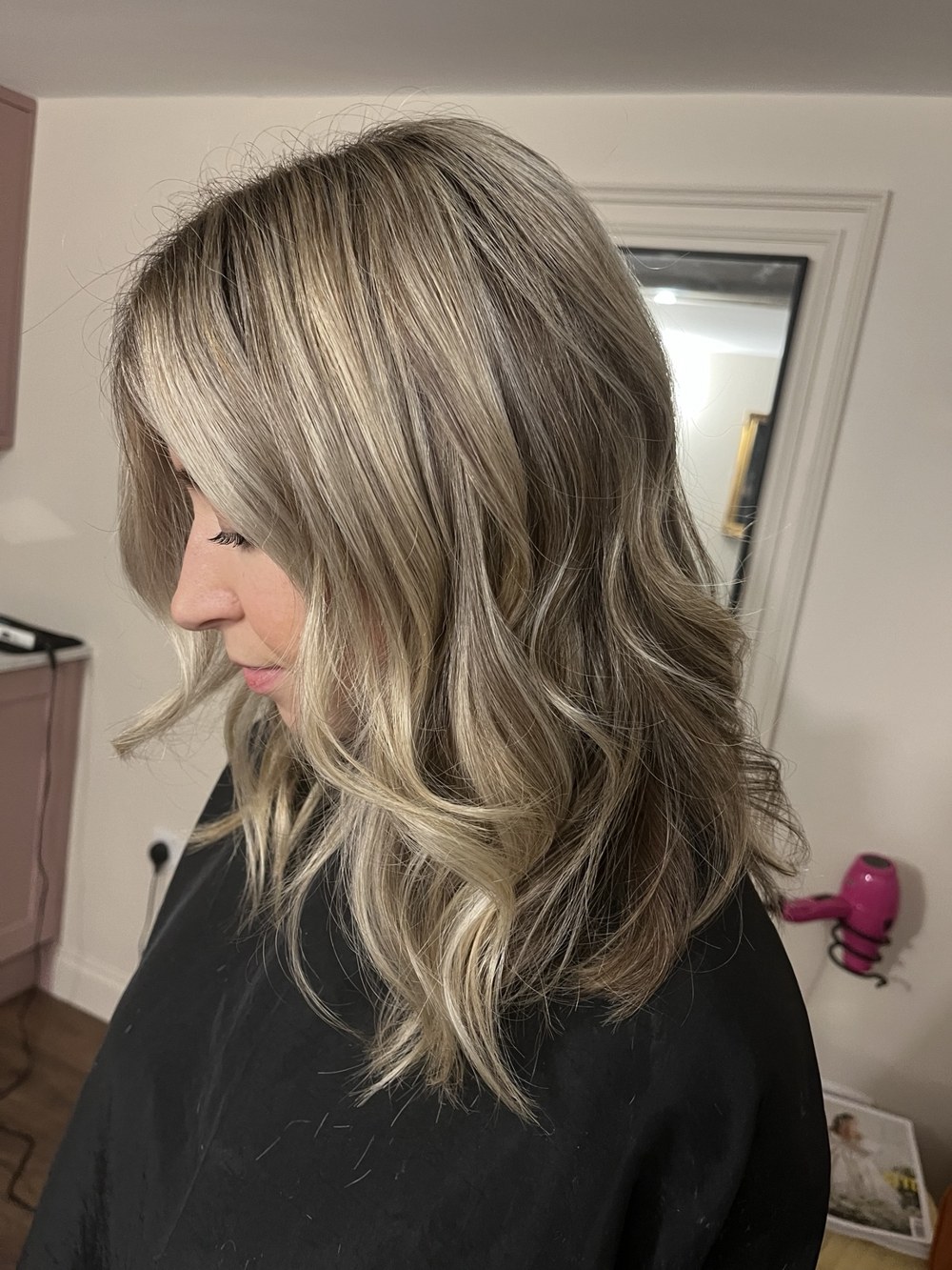 Face-framing blonde with soft waves by Selina at The Room