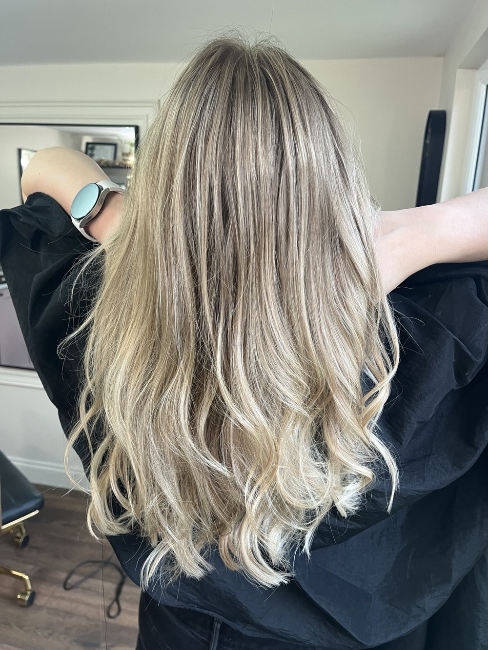 Long blonde waves with blended roots by Selina at The Room